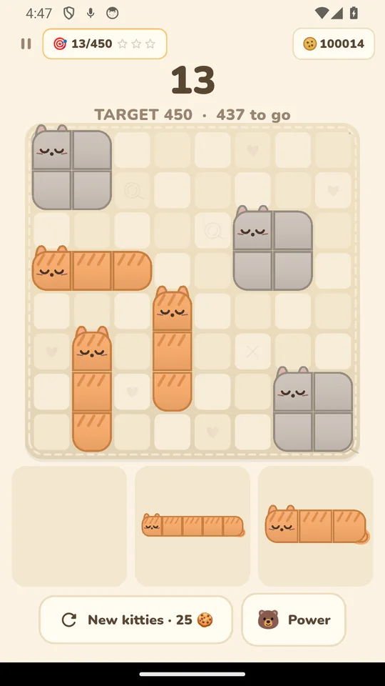 A game of Snoozy Cats in progress: sleeping kittens of several colours placed on the 8 by 8 blanket, with the score and target above.